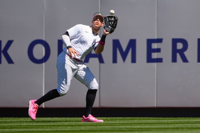 New York Yankees right fielder Aaron Judge catches a fly ball.